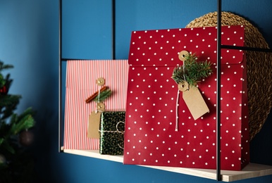 Beautifully decorated Christmas presents on rack indoors