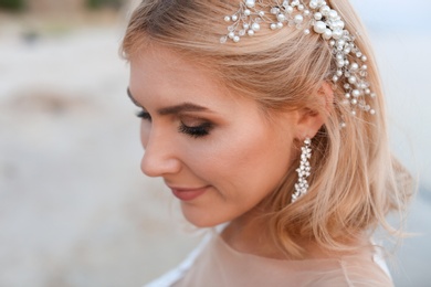 Portrait of beautiful and happy bride on beach. Wedding day