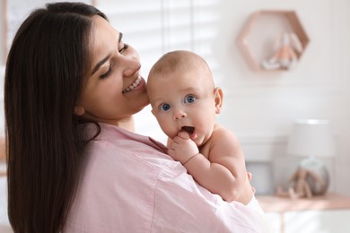 Mother with her cute baby at home