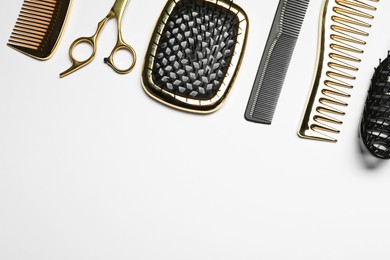 Hairdressing tools on white background, flat lay. Space for text