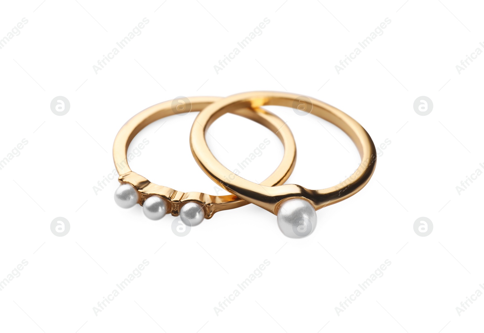 Photo of Elegant rings with pearls isolated on white