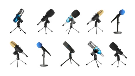 Set of different microphones on white background