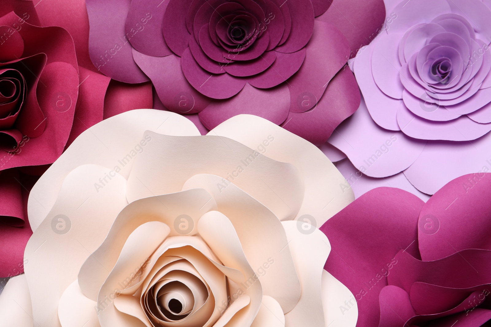 Photo of Different beautiful flowers made of paper as background, top view