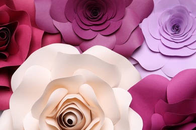 Different beautiful flowers made of paper as background, top view
