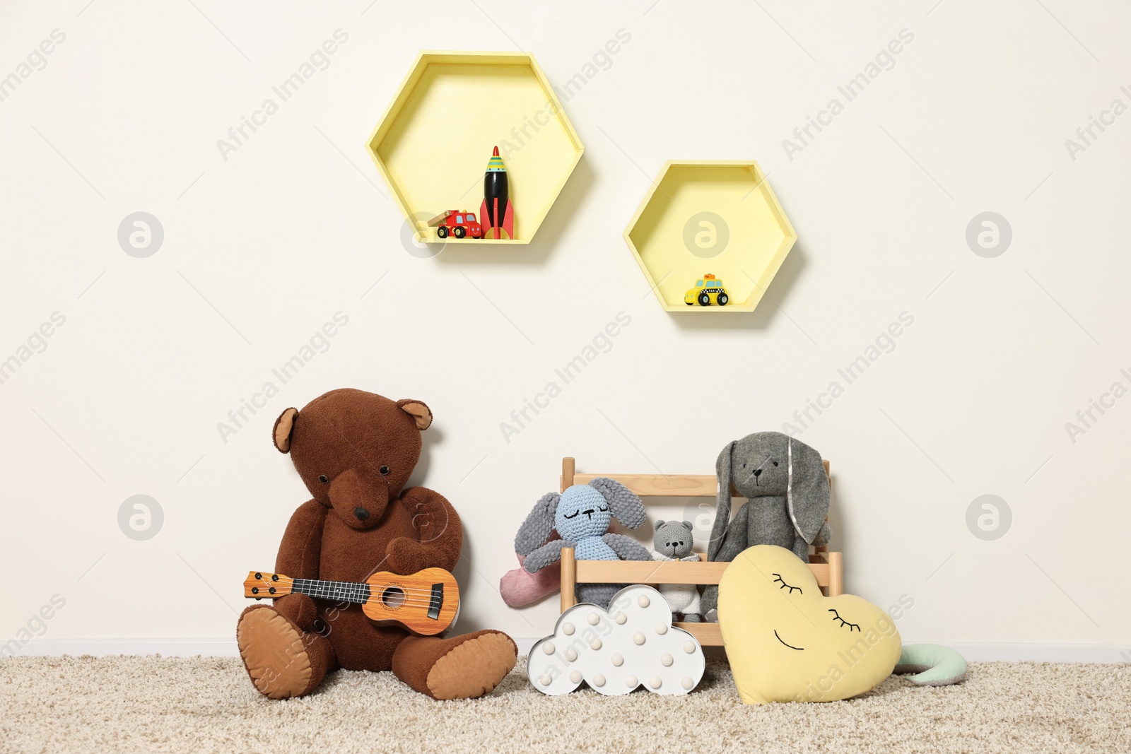 Photo of Soft toys and shelfs in beautiful children's room
