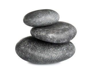 Stack of zen spa stones on white background