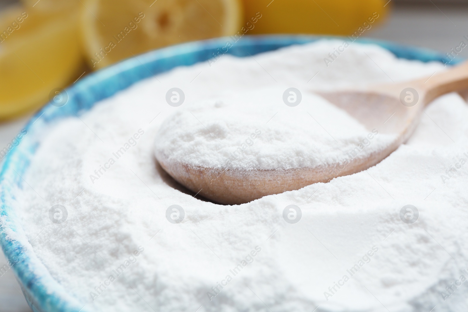 Photo of Bowl and spoon with baking soda, closeup