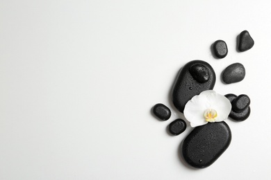 Flat lay composition with spa stones and space for text on white background