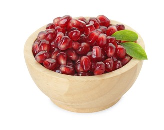 Photo of Ripe juicy pomegranate grains and leaves in wooden bowl isolated on white