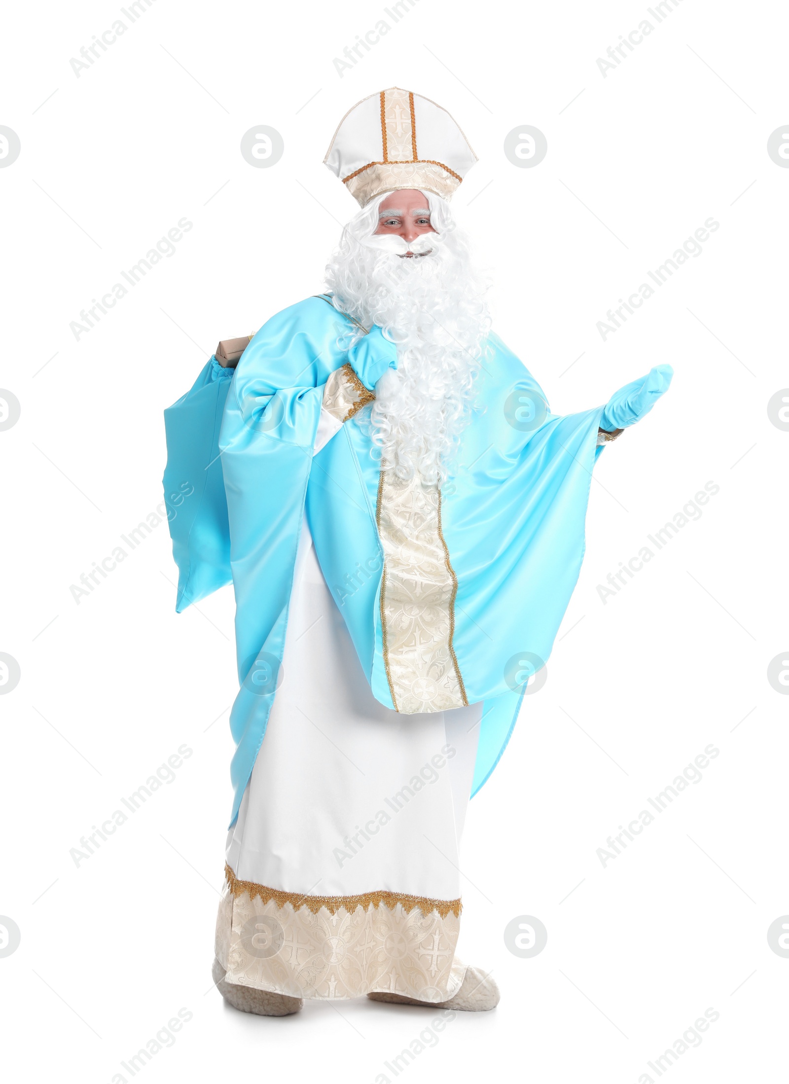 Photo of Full length portrait of Saint Nicholas holding sack with presents on white background