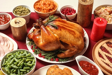 Traditional festive dinner with delicious roasted turkey served on table