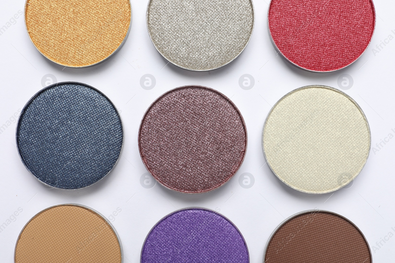 Photo of Beautiful eye shadow refill pans on white background, flat lay