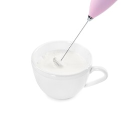 Photo of Whisking milk in cup with mini mixer (frother wand) isolated on white