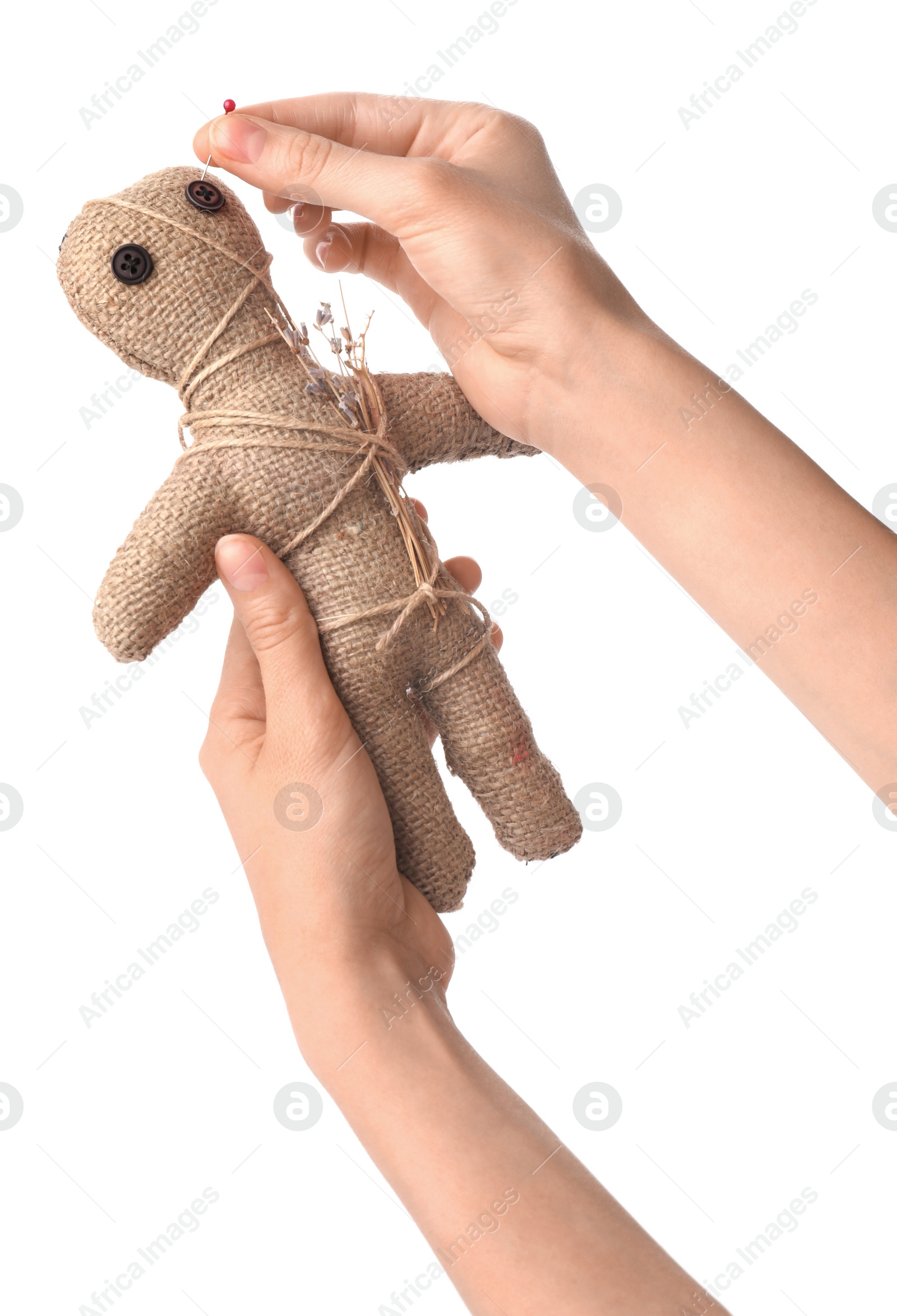 Photo of Woman stabbing voodoo doll with pin on white background, closeup