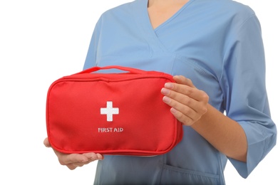 Female doctor holding first aid kit on white background, closeup. Medical object