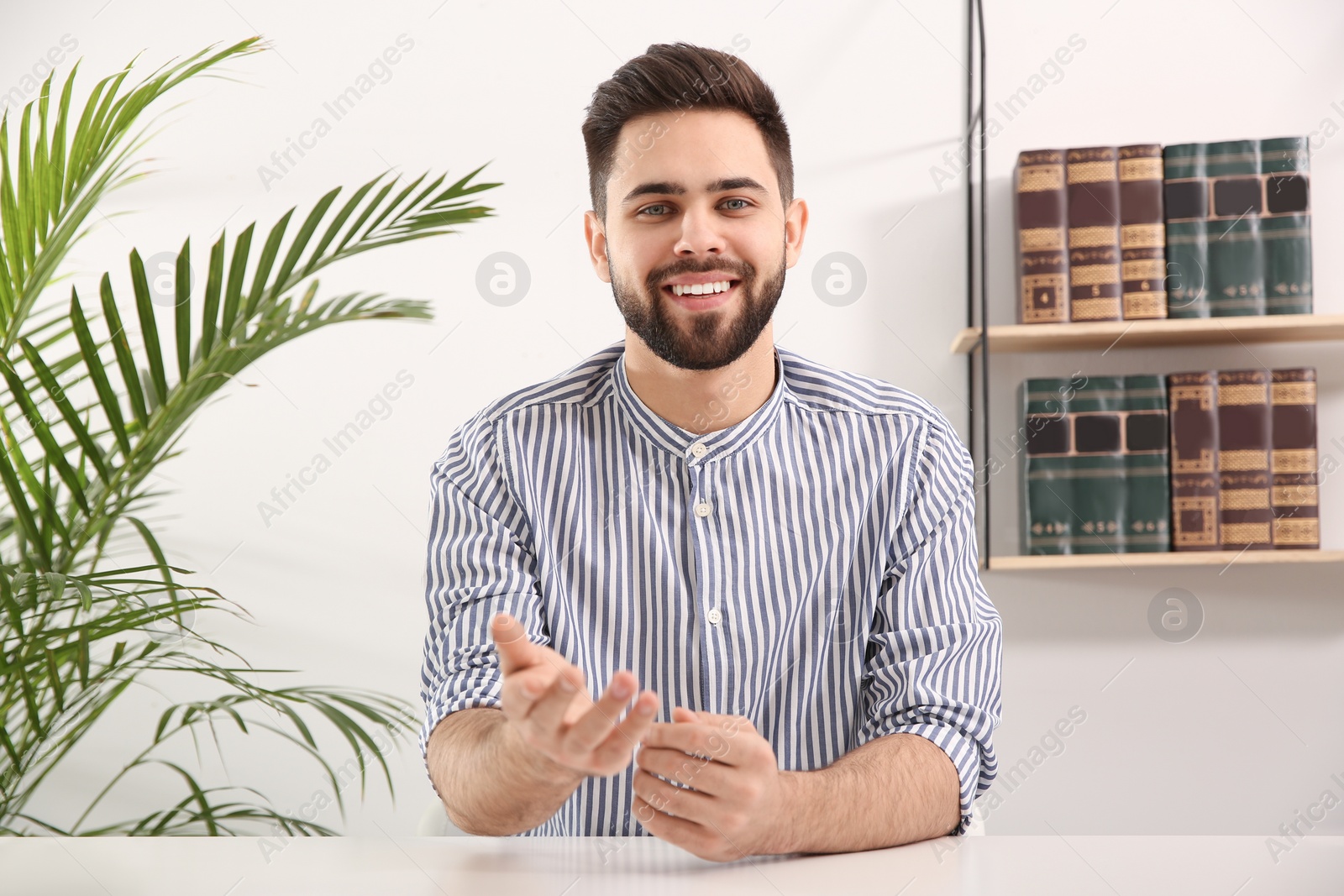 Photo of Young man using video chat at home, view from web camera