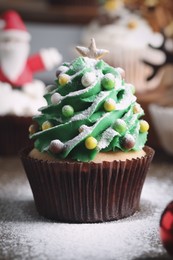 Christmas tree shaped cupcake on table, closeup