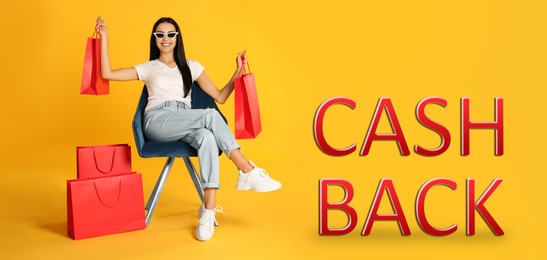 Image of Beautiful woman with paper shopping bags in armchair and words Cash Back on yellow background. Banner design