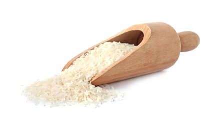 Scoop with uncooked long grain rice on white background