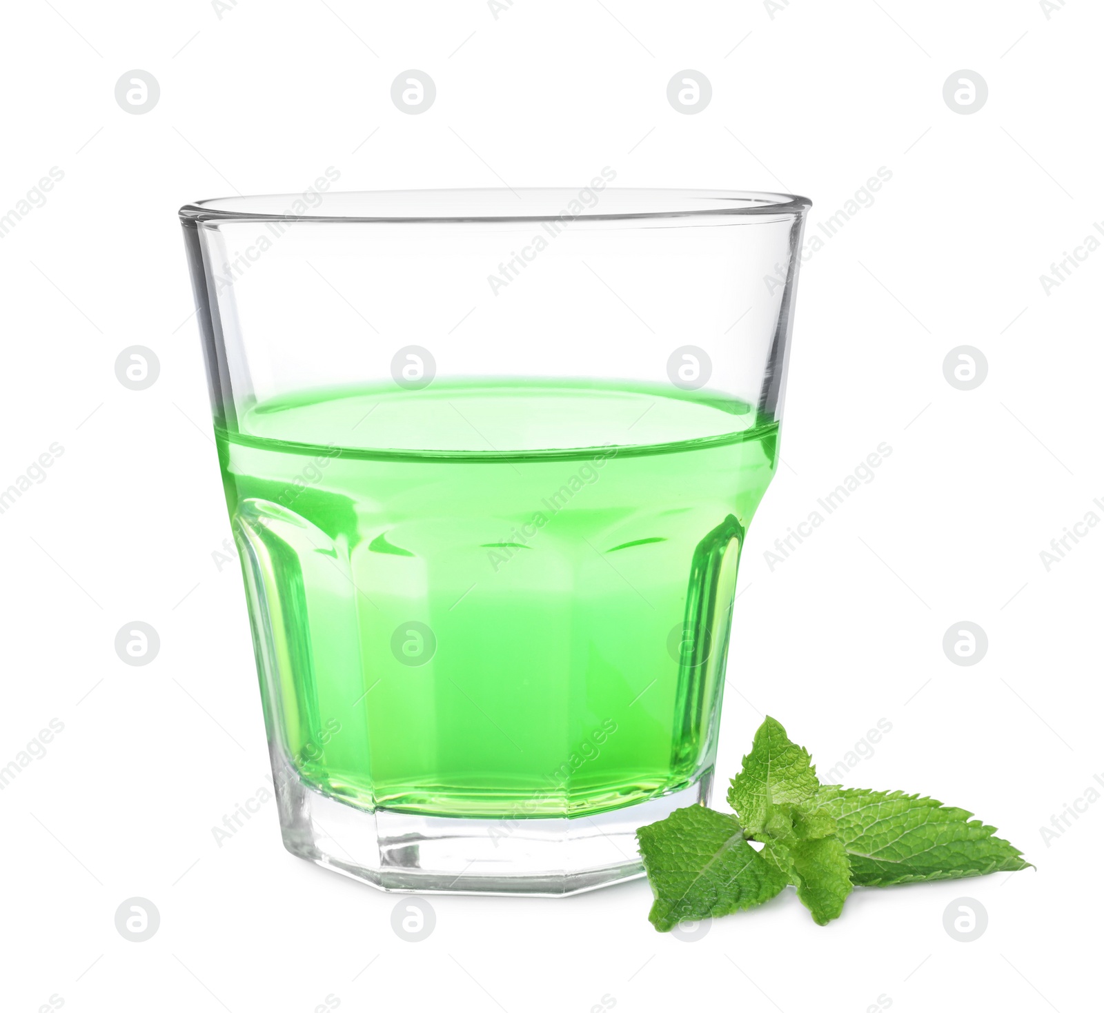 Photo of Delicious mint liqueur and fresh leaves isolated on white