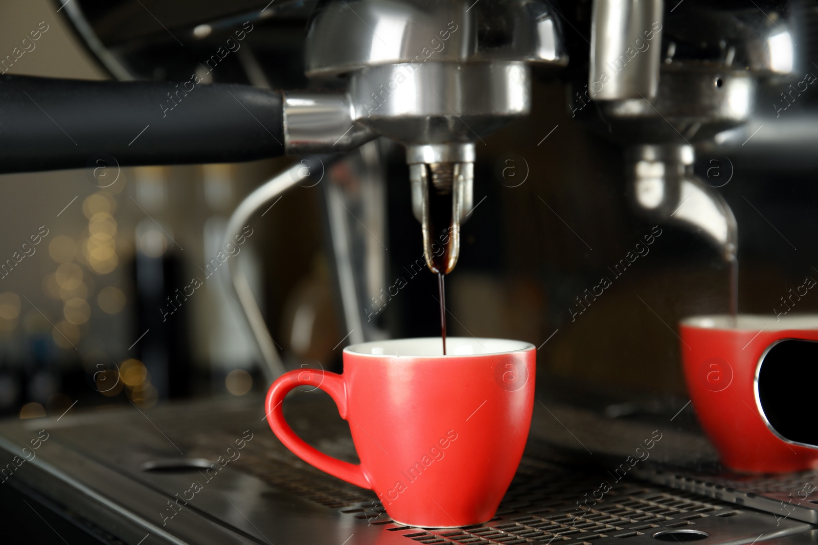 Photo of Making fresh aromatic espresso using professional coffee machine