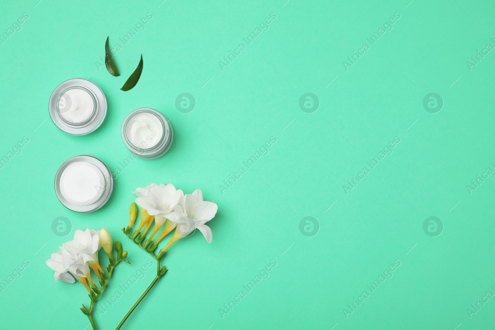 Photo of Flat lay composition with cosmetic products on color background