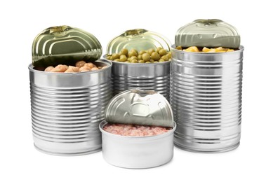 Photo of Open tin cans with different products on white background