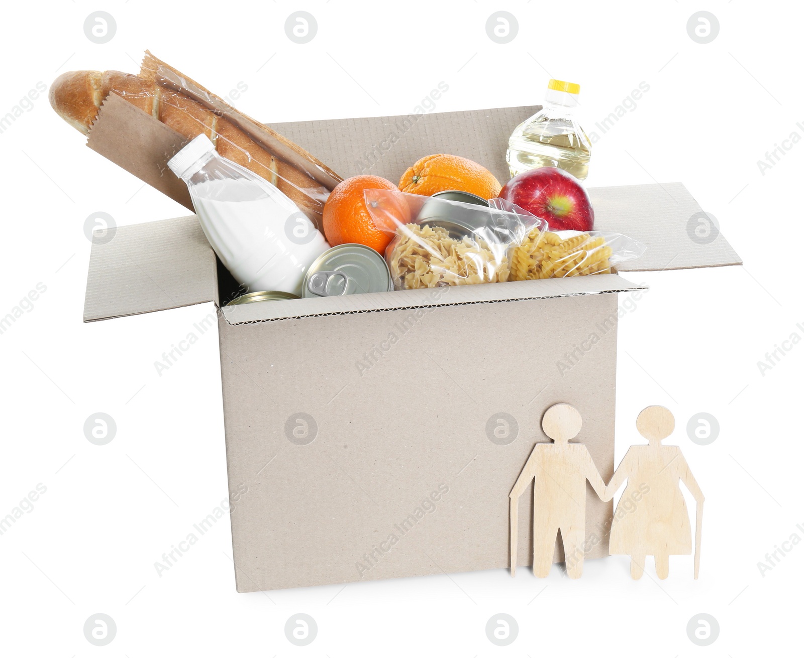 Photo of Humanitarian aid for elderly people. Cardboard box with donation food and wooden figures of couple isolated on white