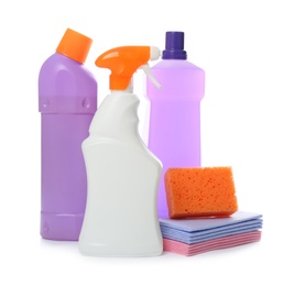 Different cleaning products and tools on white background