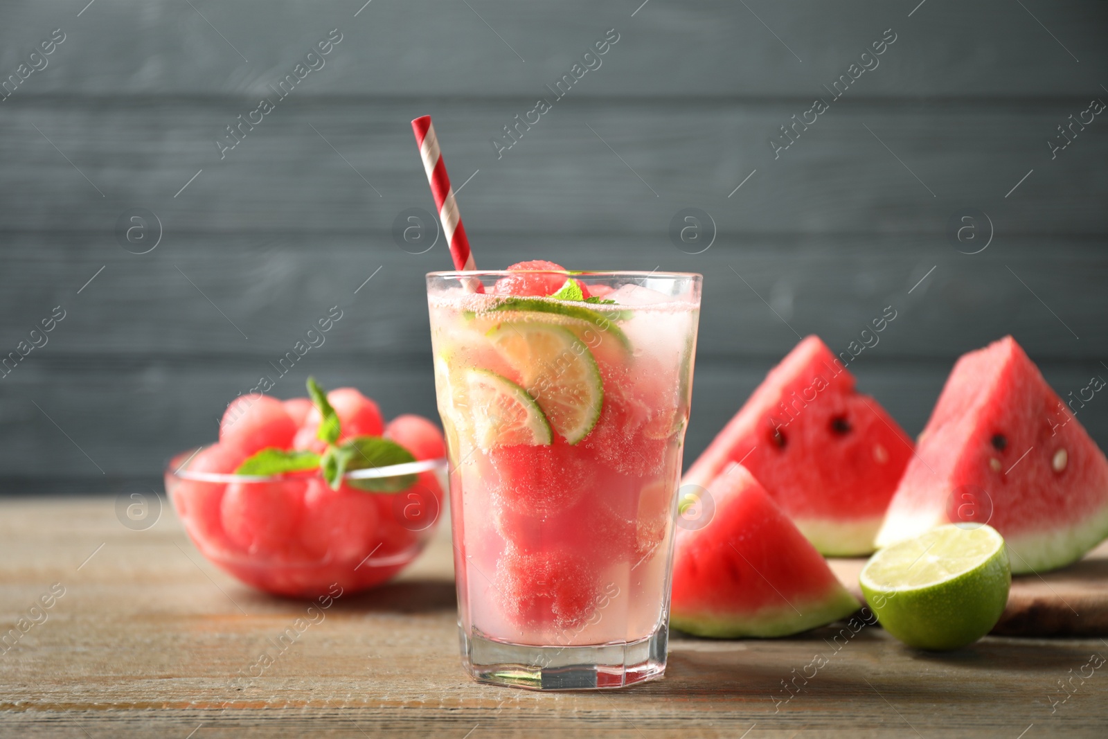 Photo of Glass of refreshing watermelon drink on wooden table