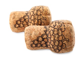 Photo of Two sparkling wine corks with grape images on white background