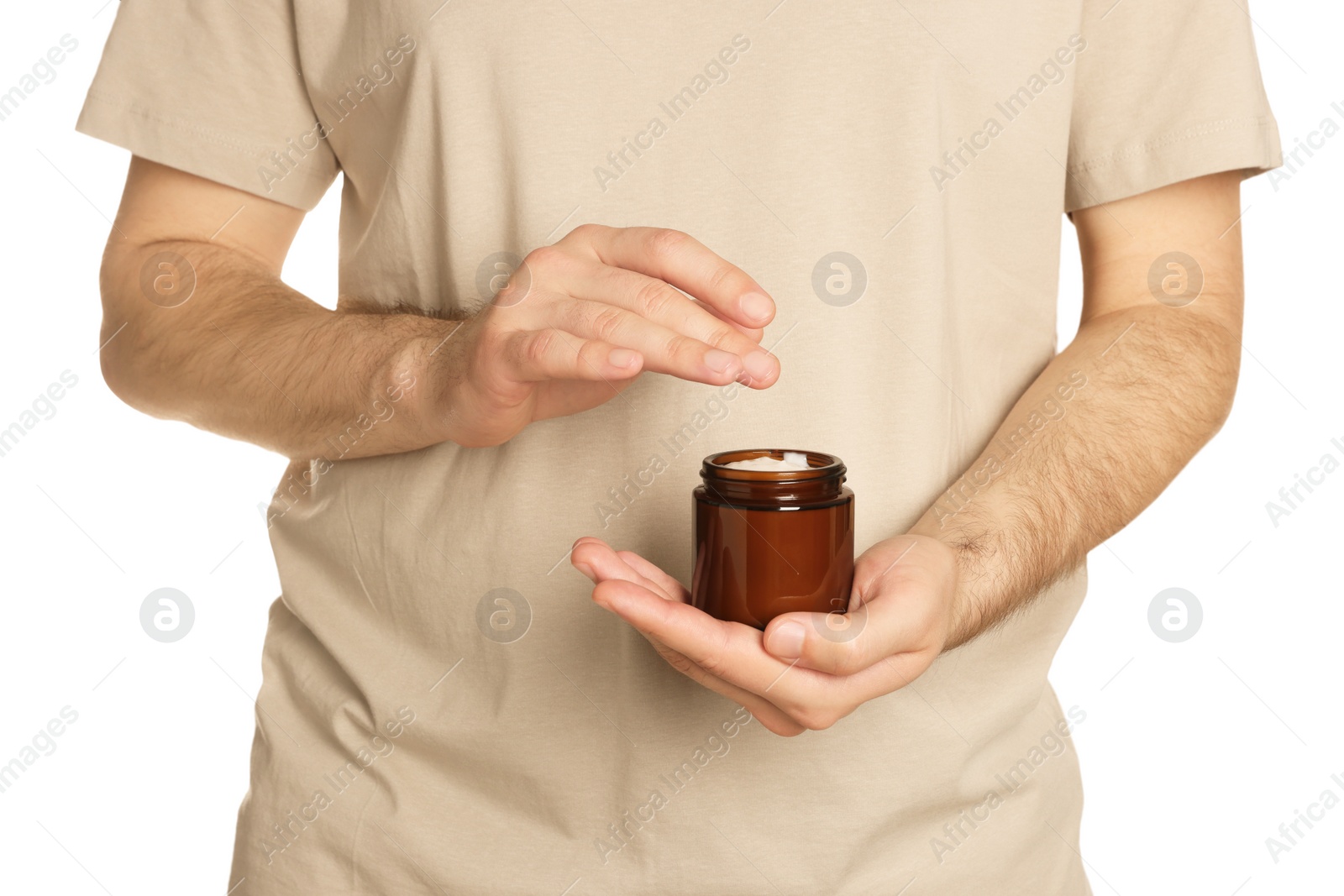 Photo of Man holding jar of hand cream on white background, closeup