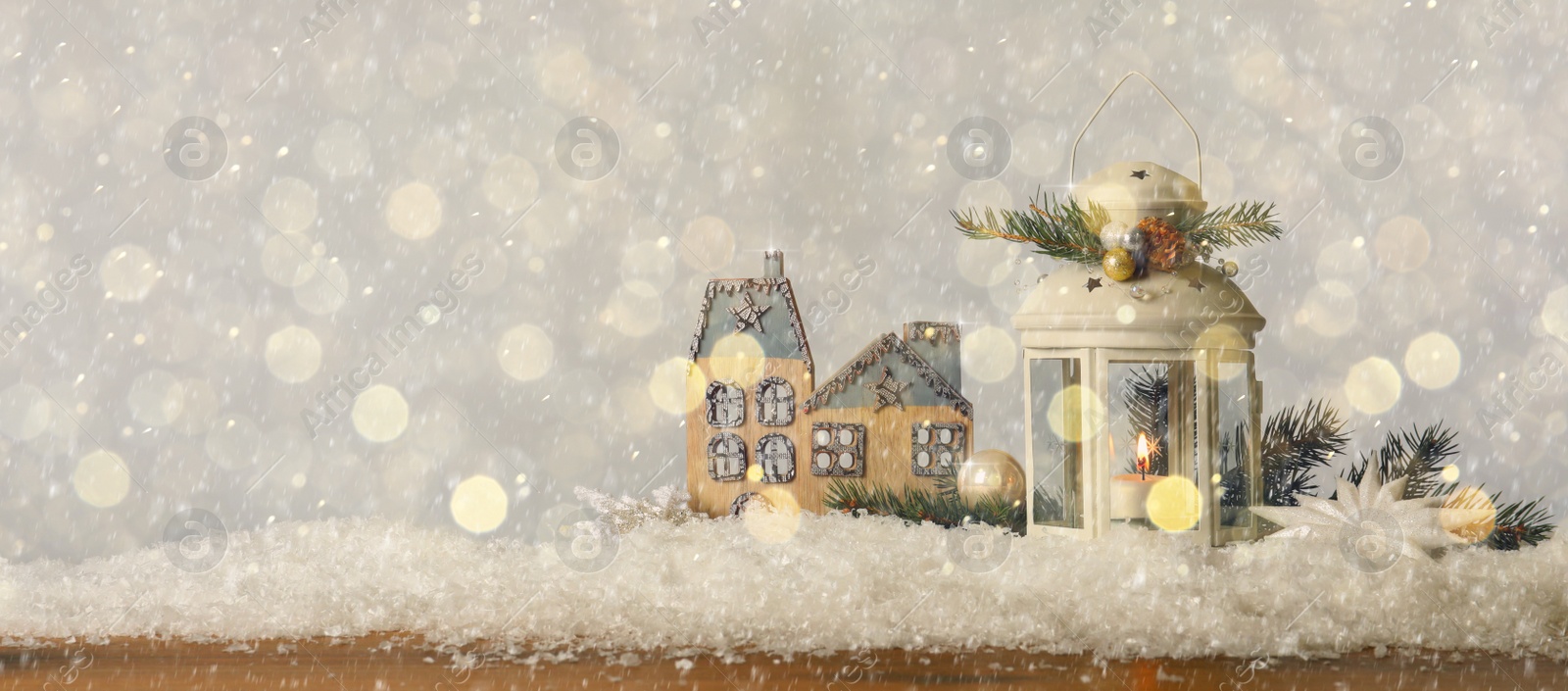 Image of Composition with Christmas lantern on snow, space for text. Bokeh effect