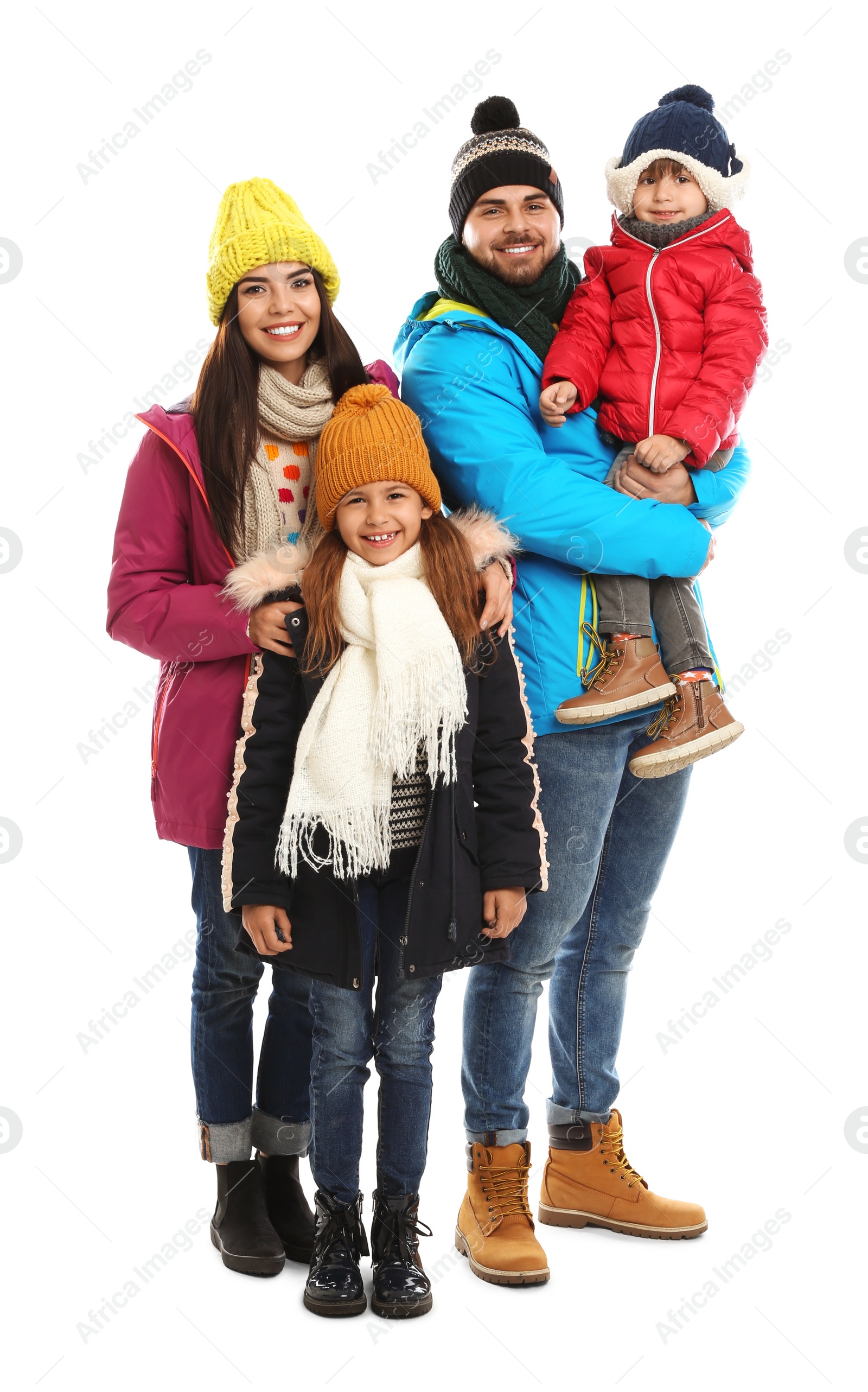 Photo of Happy family in warm clothes on white background. Winter vacation