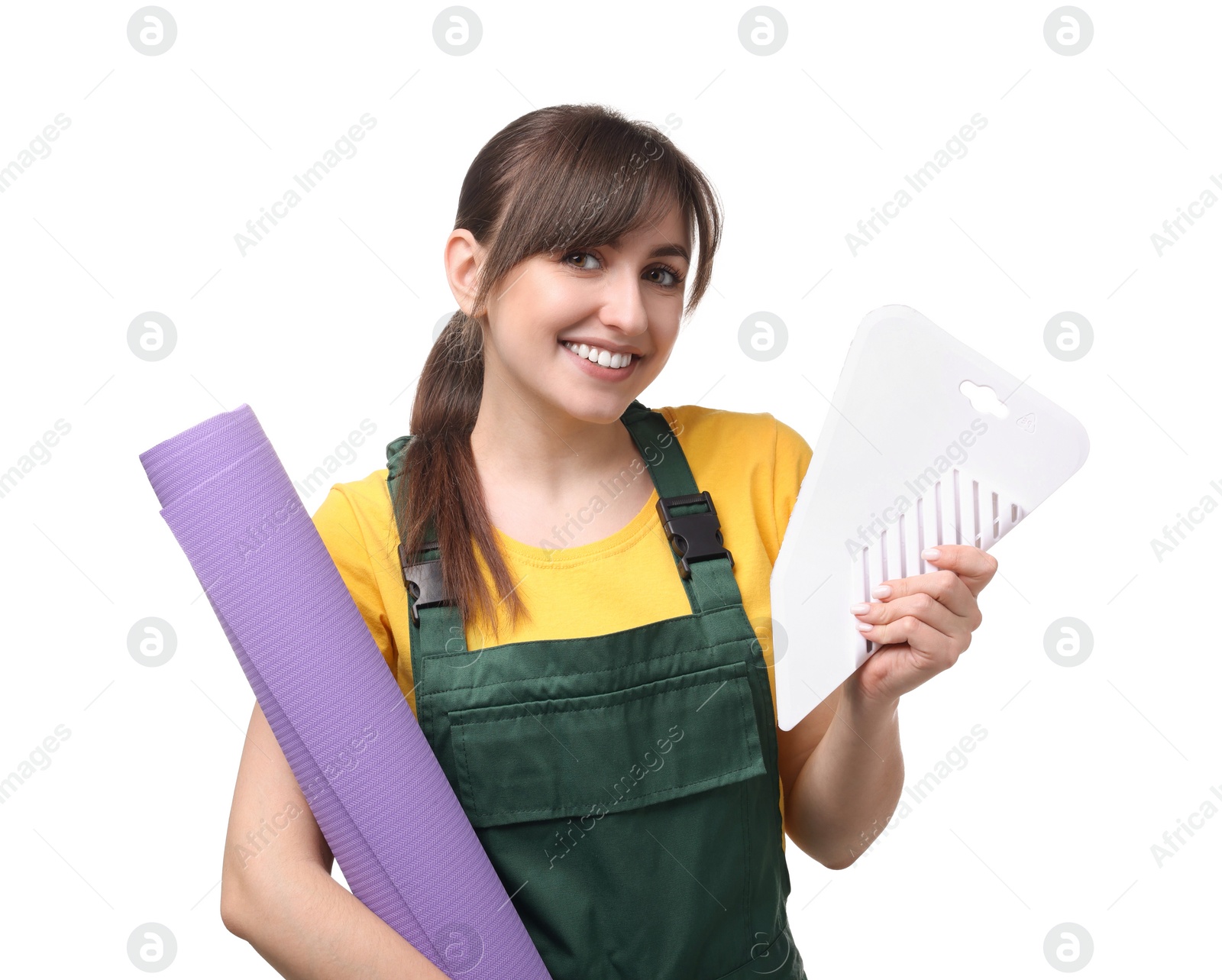 Photo of Beautiful woman with wallpaper roll and spatula on white background