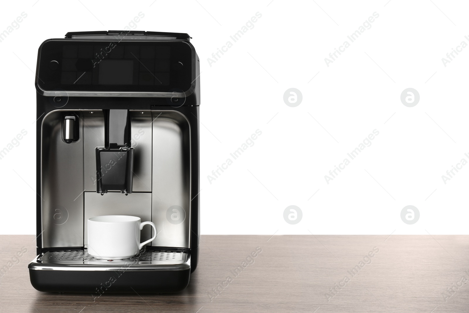 Photo of Modern coffee machine with cup on wooden table against white background. Space for text