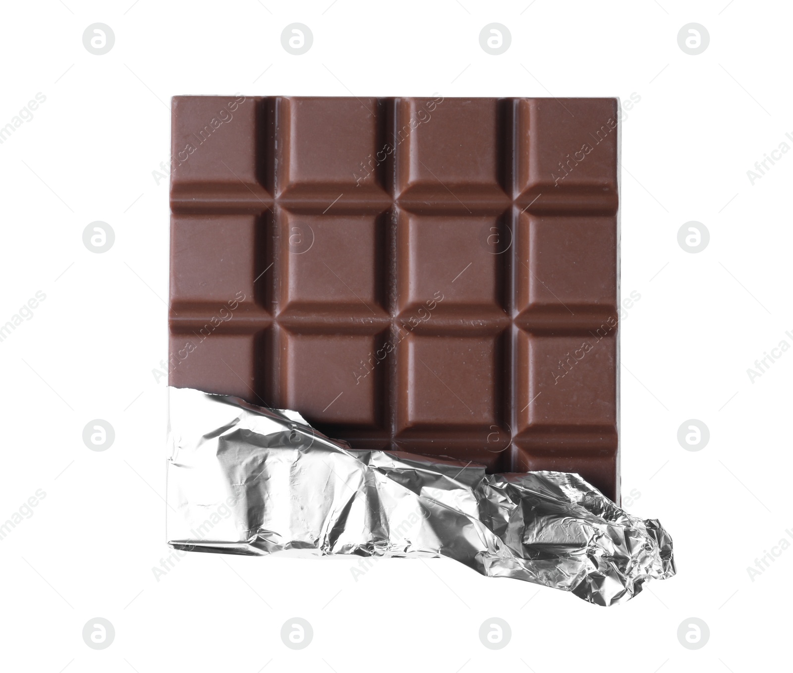 Photo of Delicious milk chocolate bar wrapped in foil isolated on white