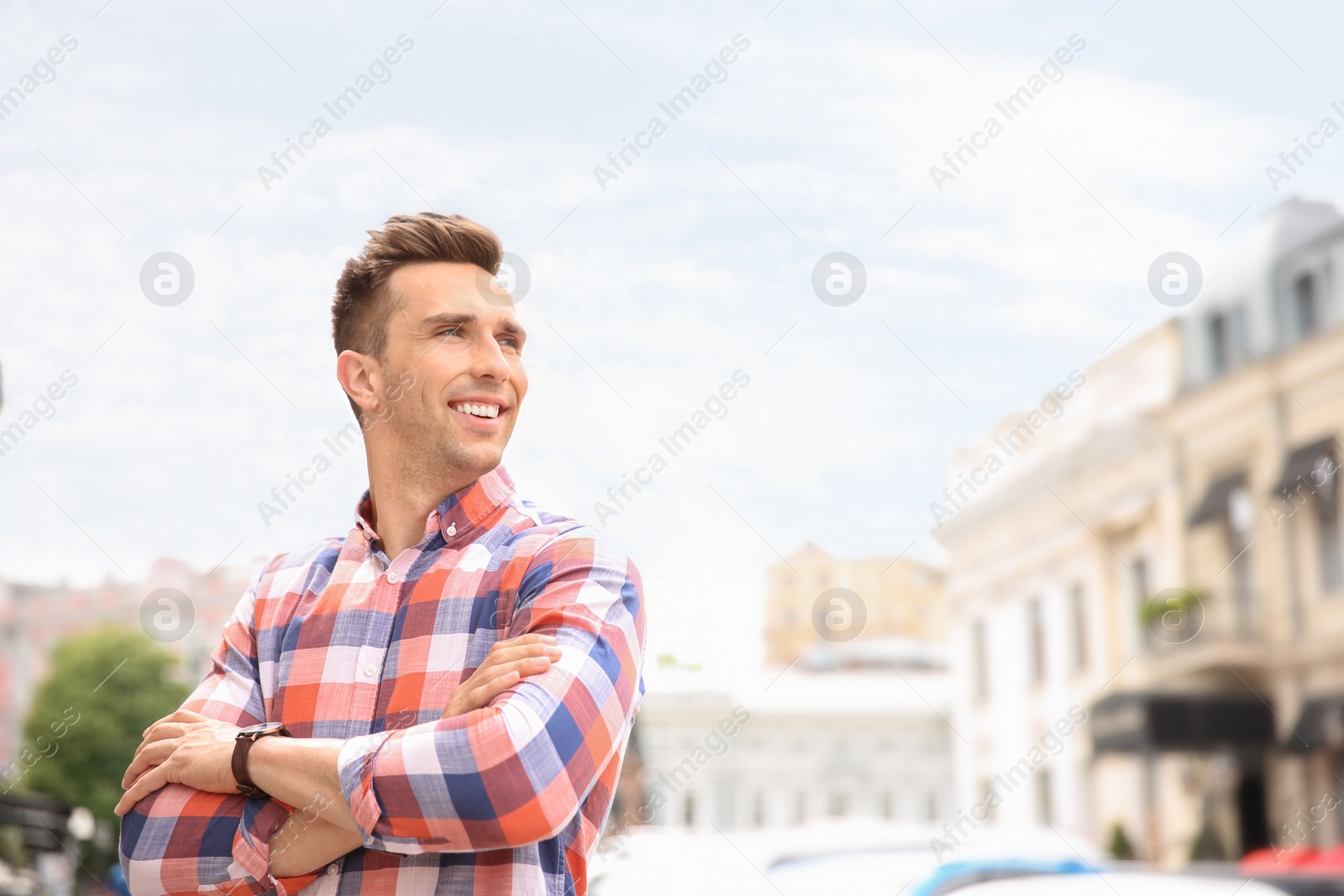 Photo of Portrait of attractive young man in stylish outfit outdoors