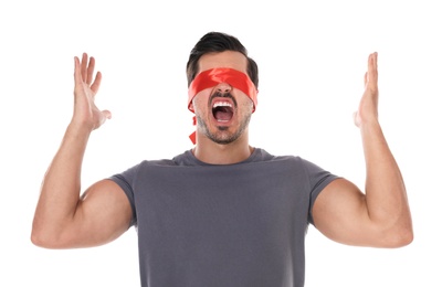 Emotional young man wearing red blindfold on white background