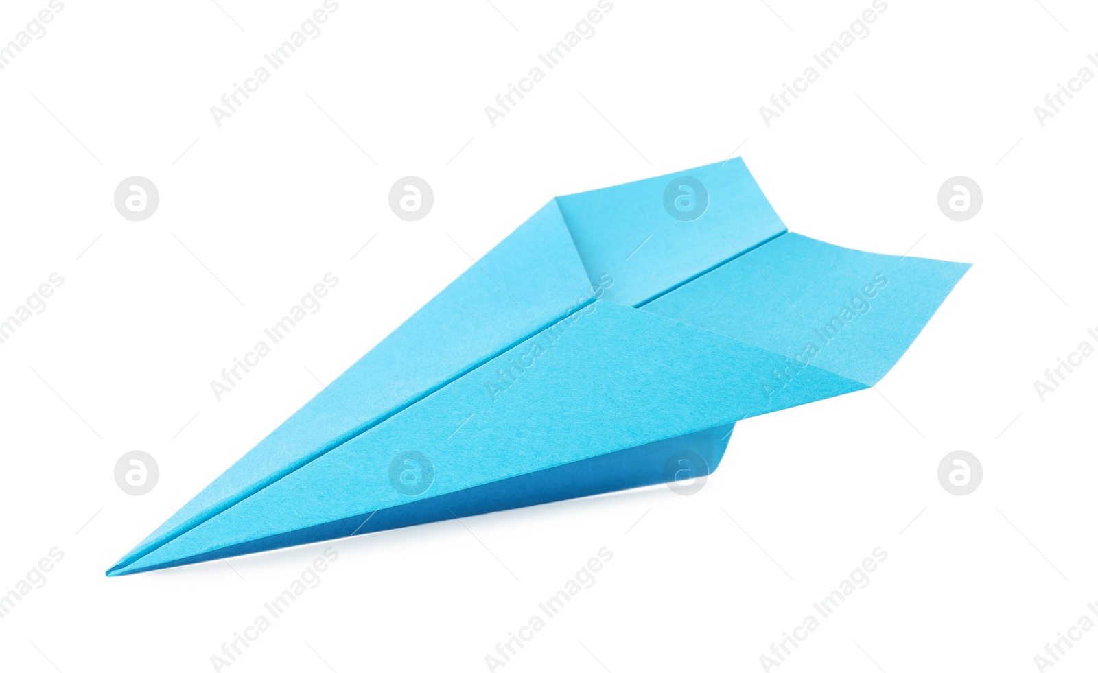 Photo of Handmade light blue paper plane isolated on white