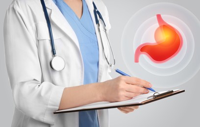 Treatment of heartburn and other gastrointestinal diseases. Doctor with clipboard on light background, closeup. Stomach illustration