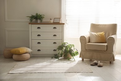 Photo of Modern room interior with stylish rug and furniture