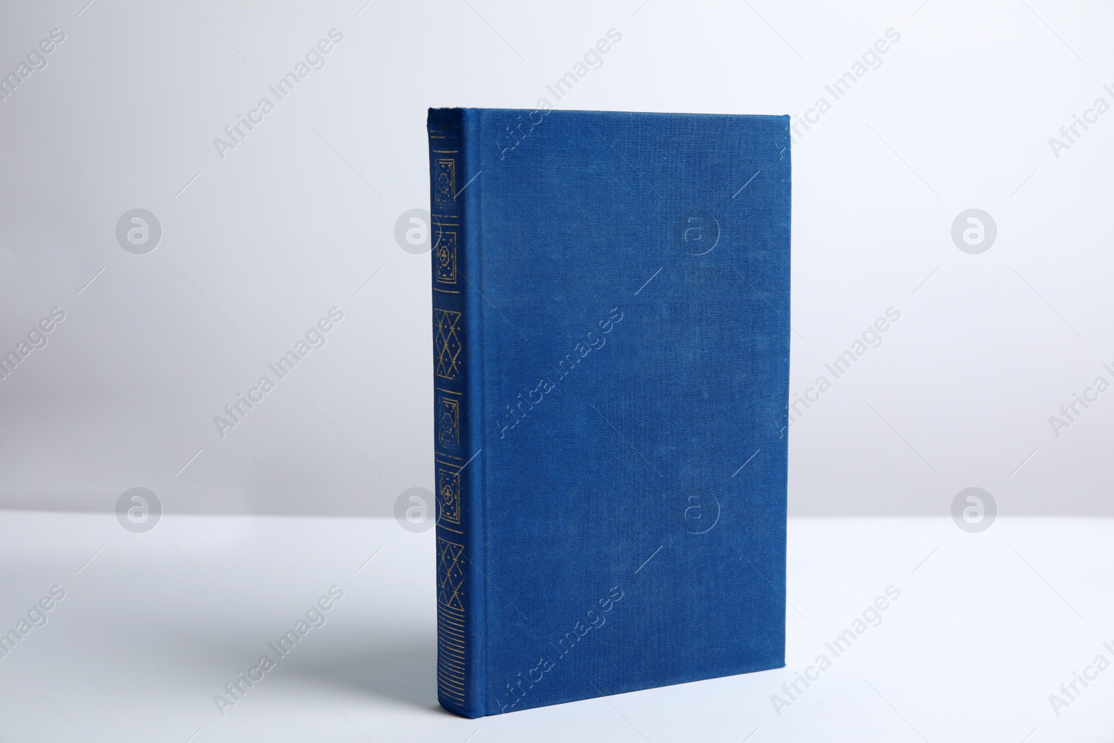 Photo of Hardcover book on white background. Space for design