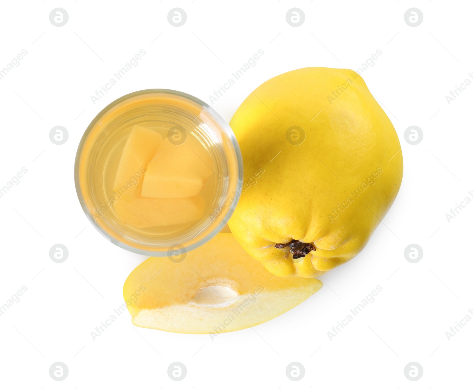 Photo of Delicious quince drink in glass and fresh fruits isolated on white, top view