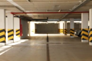 Blurred view of modern car parking garage