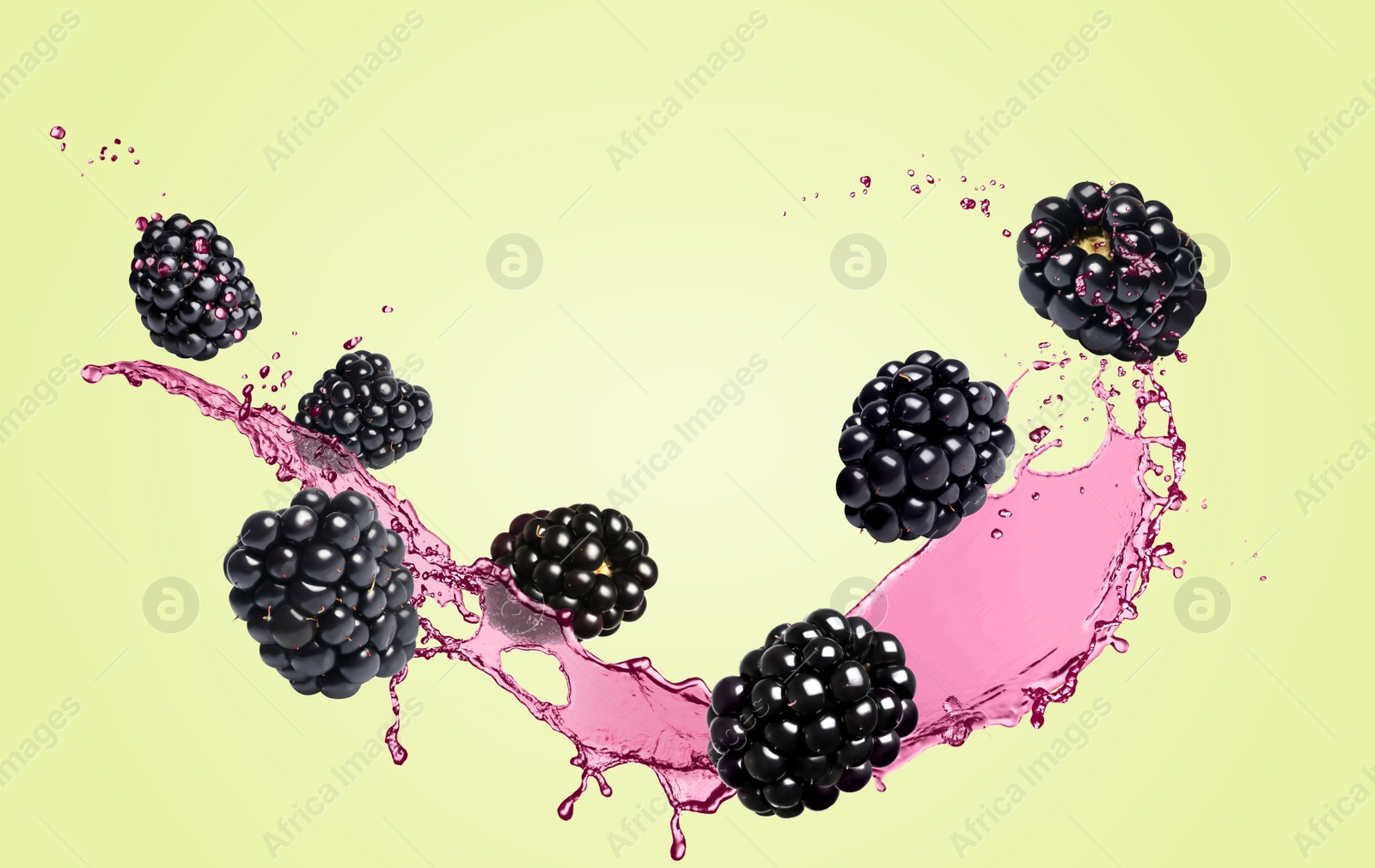 Image of Fresh blackberries and juice in air on light green background