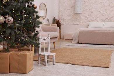 Bedroom interior with Christmas tree and festive decor