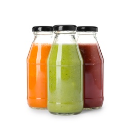 Bottles of fresh juices on white background