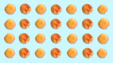 Image of Pattern of peaches on pale light blue background. Banner design