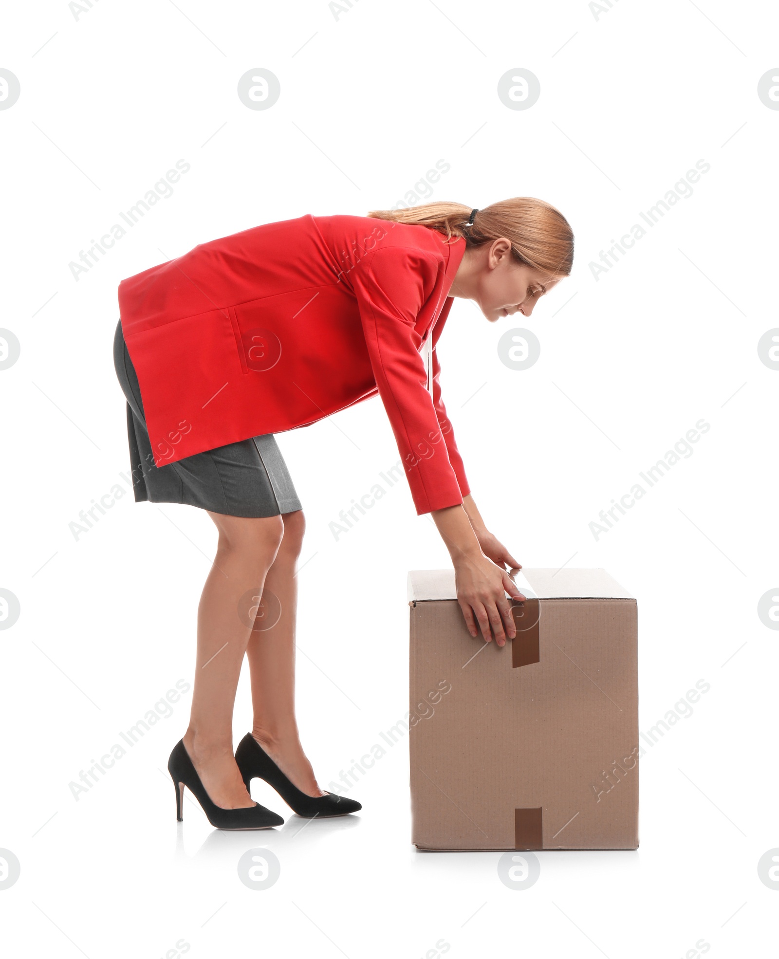 Photo of Full length portrait of woman lifting carton box on white background. Posture concept